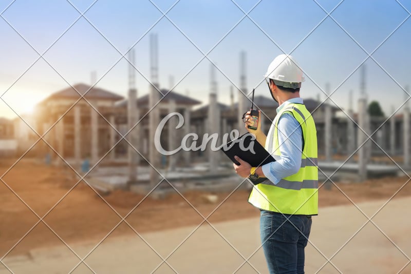 Civil engineer working in building construction site